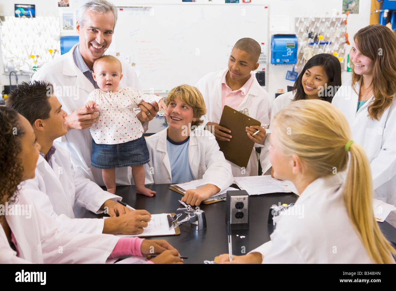 Students in biology class with teacher Stock Photo