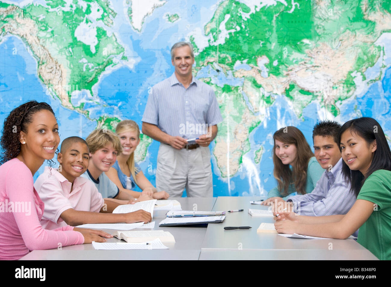 Students answering questions in geography class Stock Photo