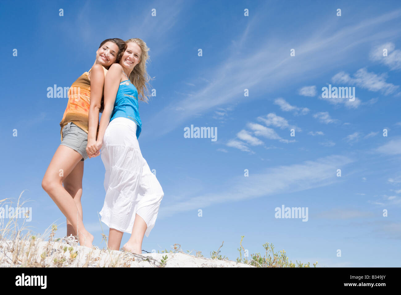 Two women standing together hi-res stock photography and images - Alamy