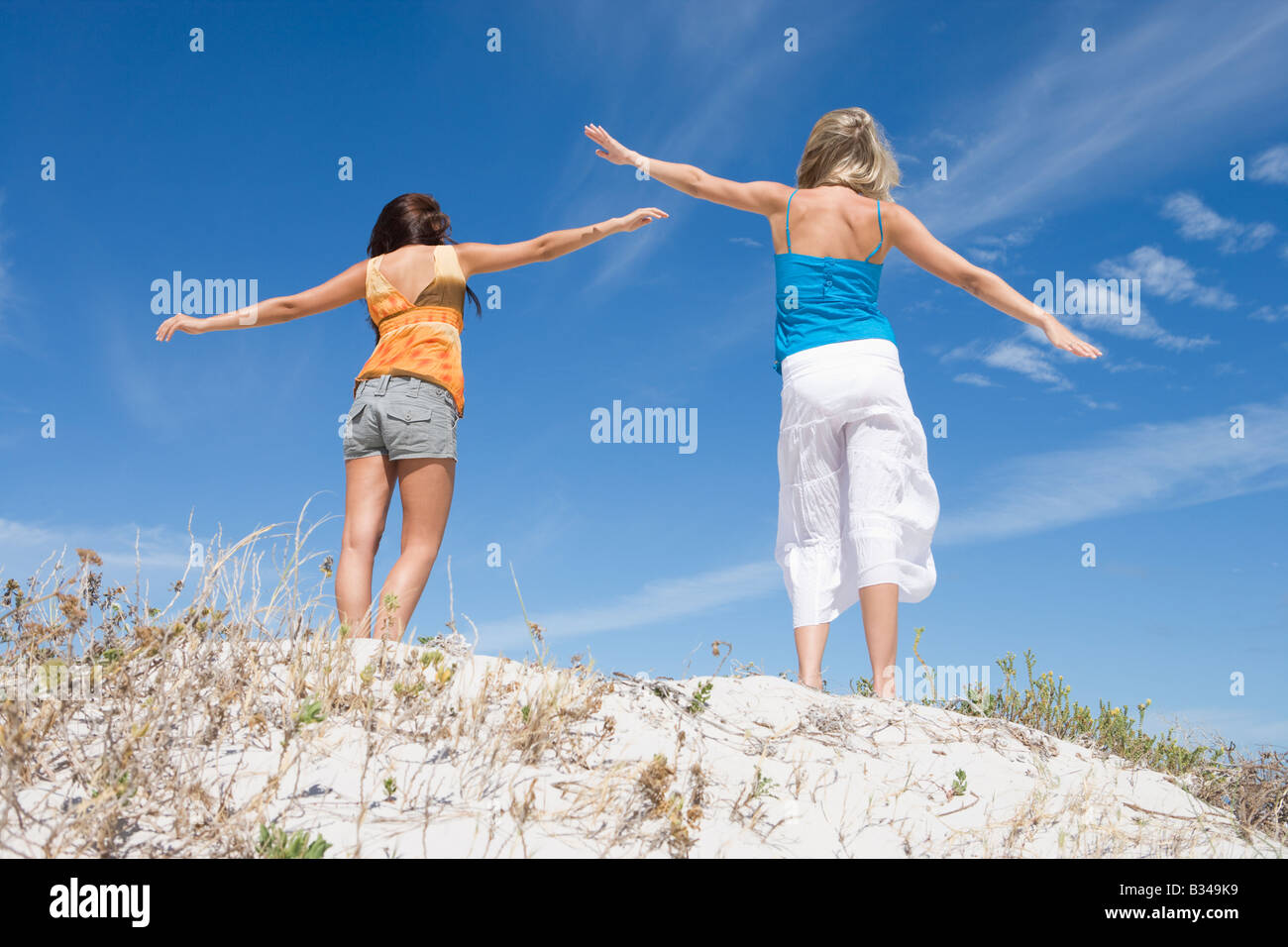Two women standing together hi-res stock photography and images - Alamy