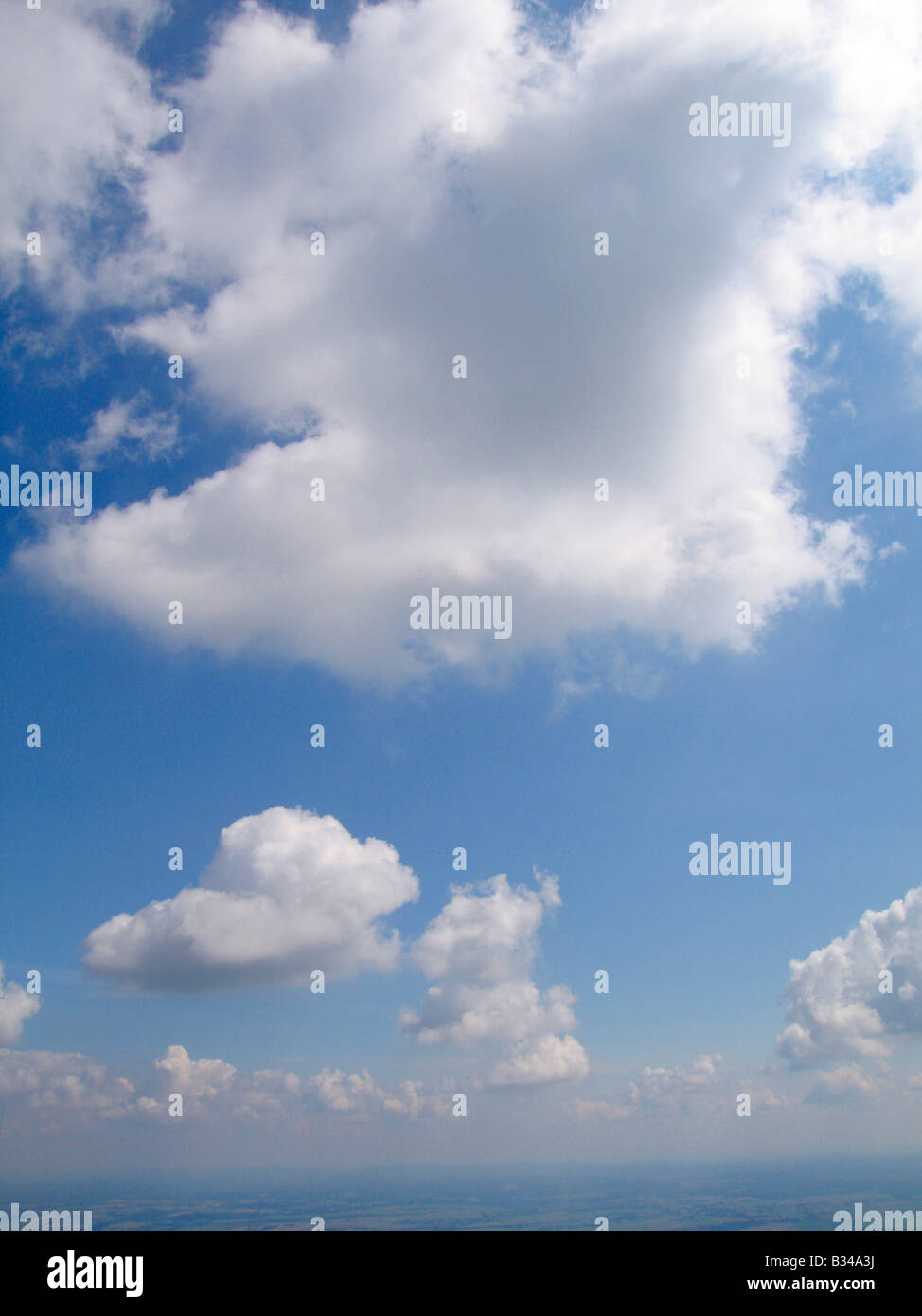 Aerial view from a sailplane of Cumulus clouds in the german sky