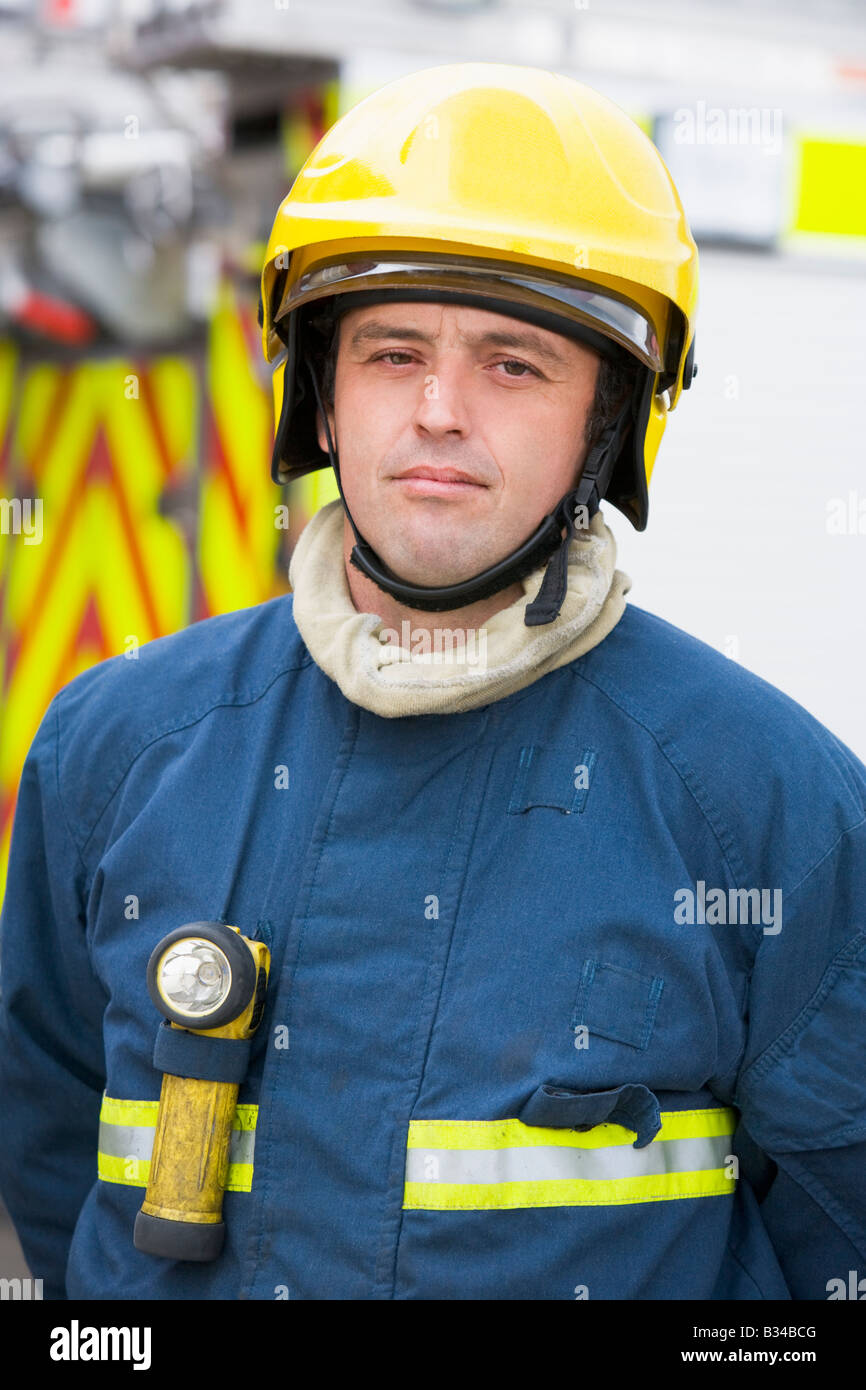 fireman-standing-by-fire-engine-wearing-helmet-stock-photo-alamy