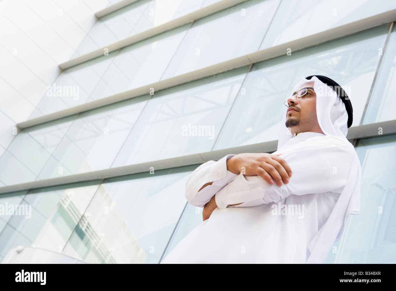Businessman standing outdoors by building (selective focus Stock Photo ...