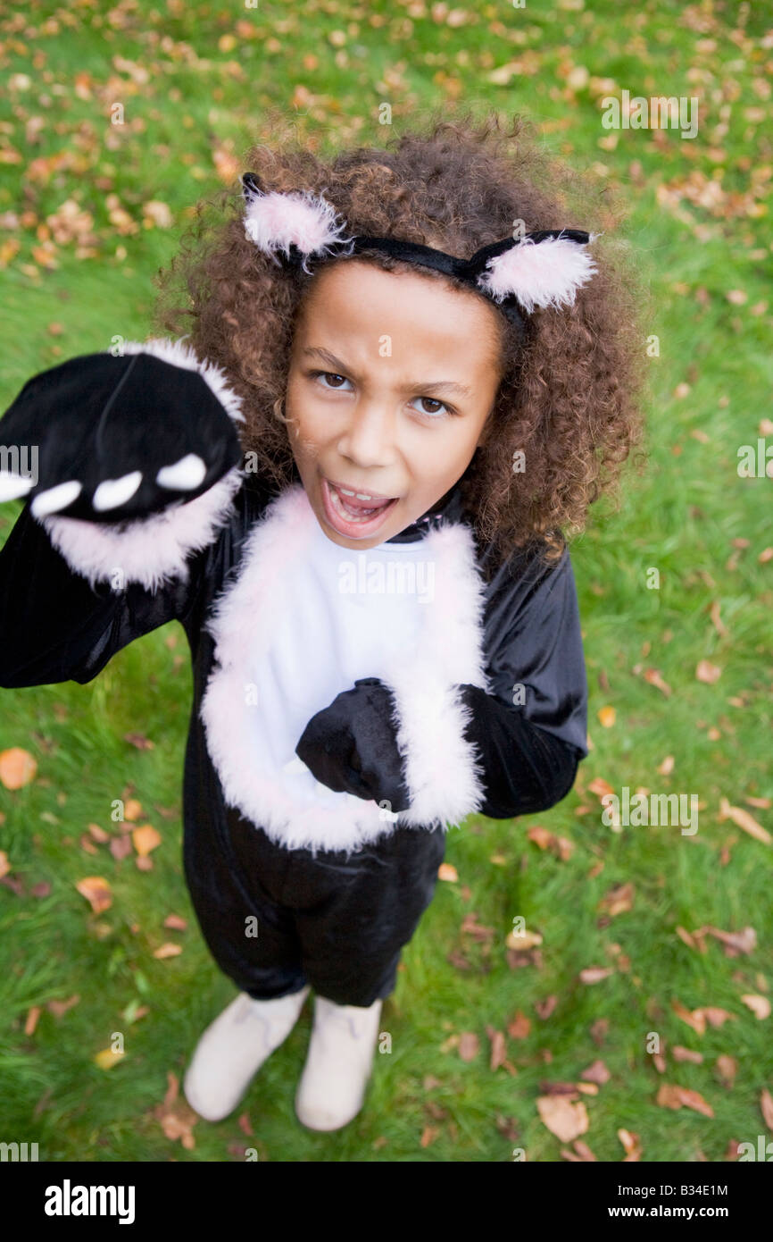 Young girl outdoors in cat costume on Halloween Stock Photo Alamy