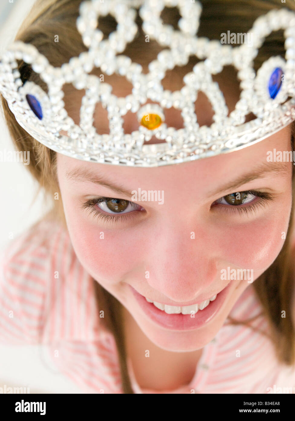 Teenage girl wearing crown and smiling Stock Photo