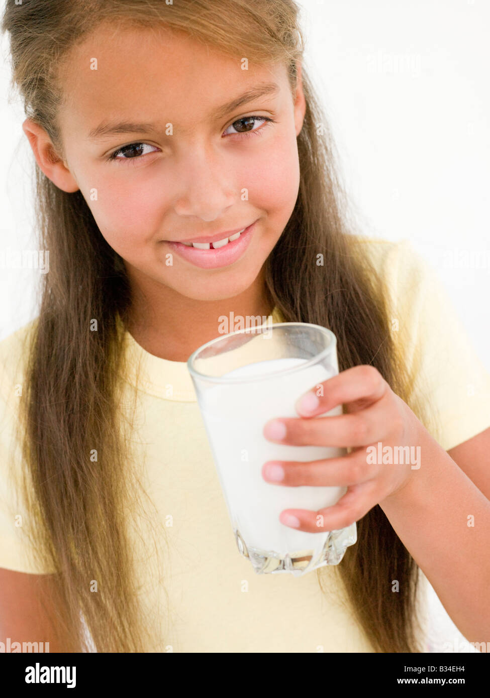 Young girl with glass of milk smiling Stock Photo Alamy