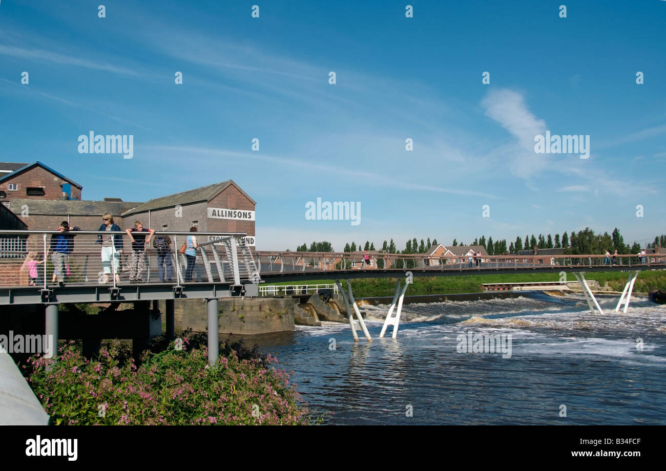 The new footbridge adjacent to the flour mill and the weir between Aire