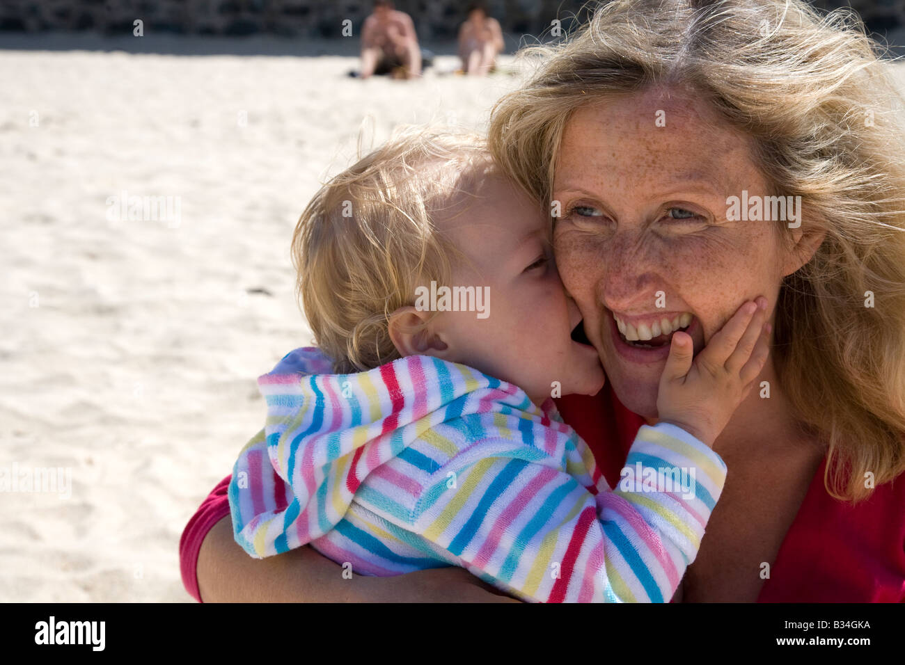 Mother and toddler on beach in summer sunshine St Ives Cornwall West Country England UK United Kingdom GB Great Britain British Stock Photo
