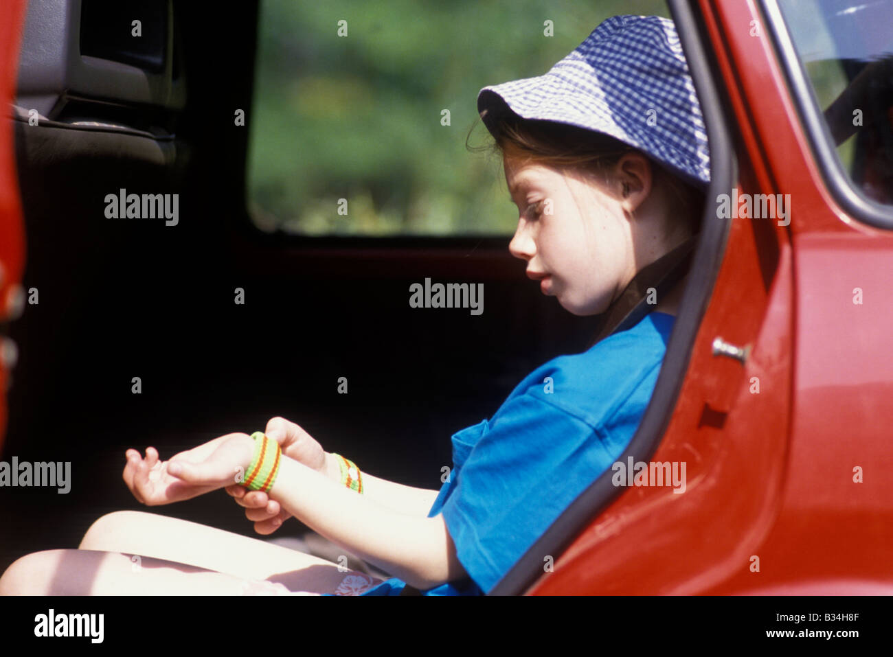 girl with travel bands for car sickness Stock Photo Alamy