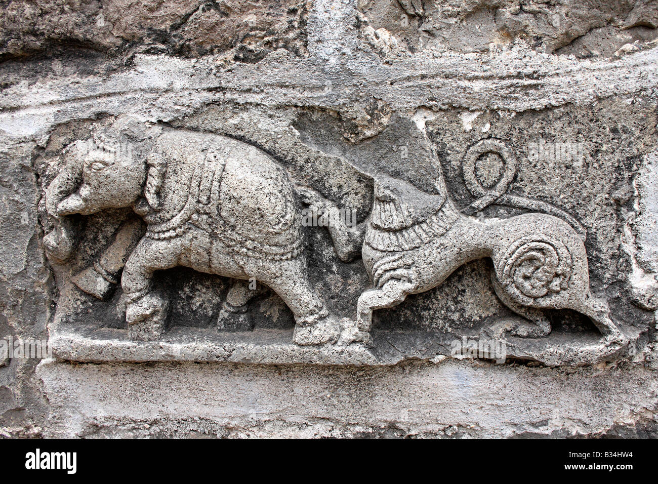 Carvings showing elephant and a mythical beast; mutilated by Moughals Bhuleshwar temple, Pune Dist. Stock Photo