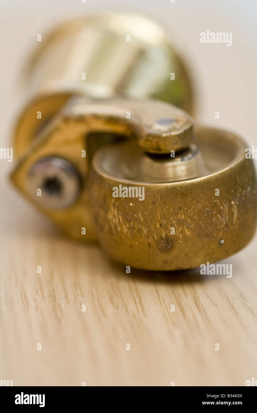 A brass castor, UK. Stock Photo
