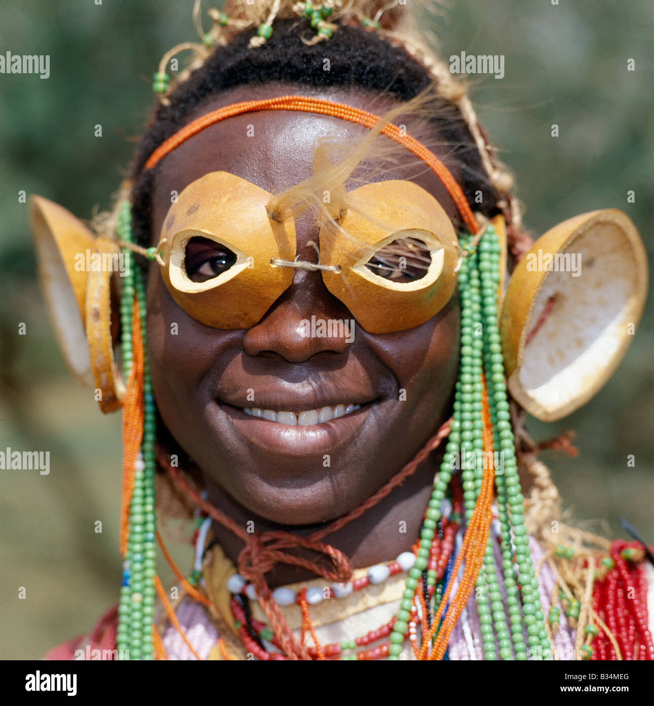 Kenya, Coast Province, Taita Hills. An Mtaita musician. His 'glasses' are made from the tips of calabashes. His ear ornaments are also made of calabashes or gourds. Stock Photo
