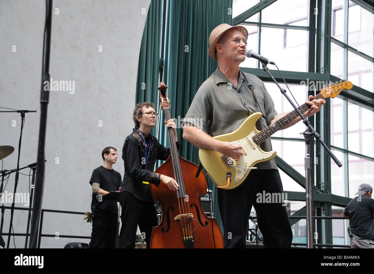 Marshall Crenshaw and other musicians rehearsing for a pop/folk concert at the Winter Garden in Battery Park City, Manhattan. Stock Photo