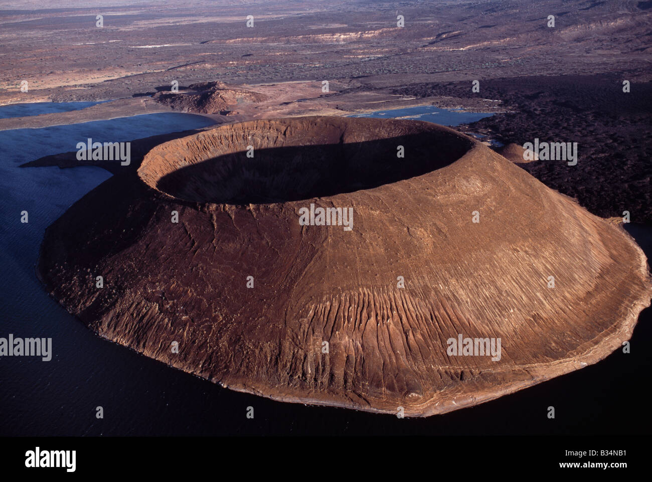 Kenya, Lake Turkana. Evening light on the south shore of Lake Turkana with the volcanic cone of Nabuyatom on the lake edge Stock Photo