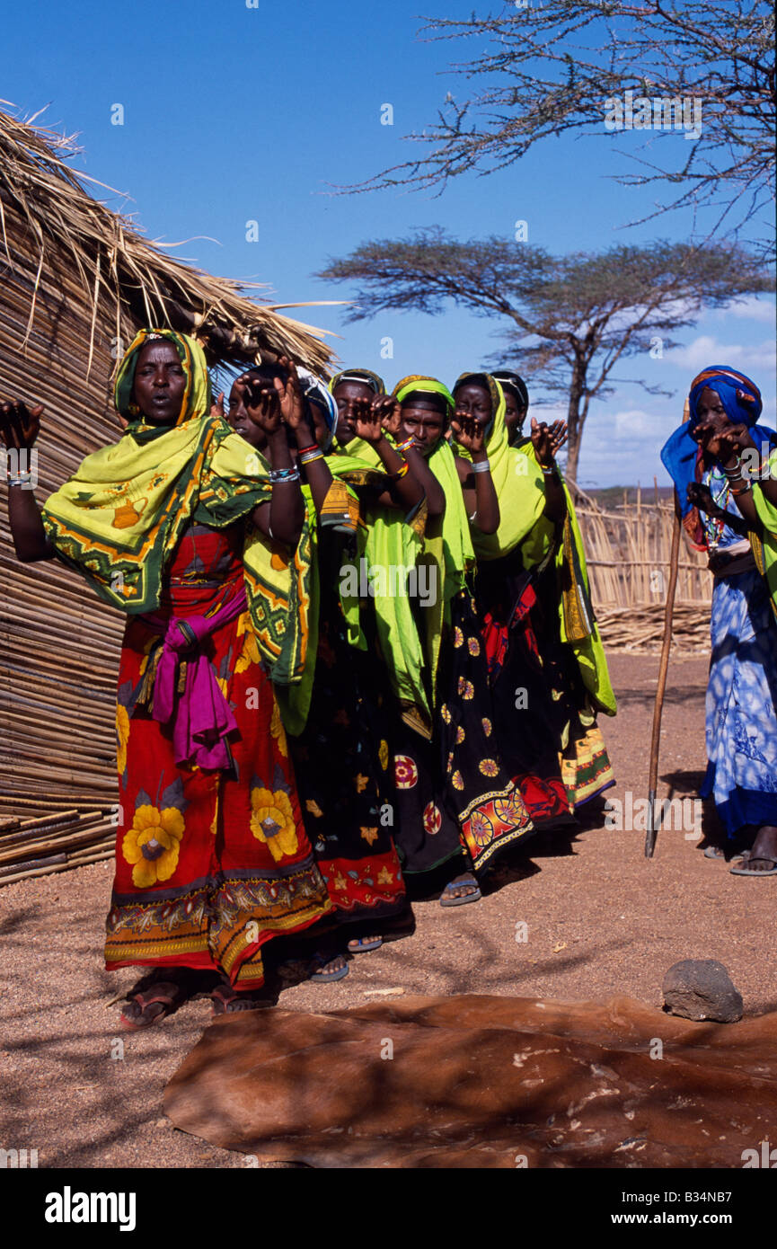 Kenya, Chalbi Desert, Kalacha. Gabbra women dance at a gathering in the ...