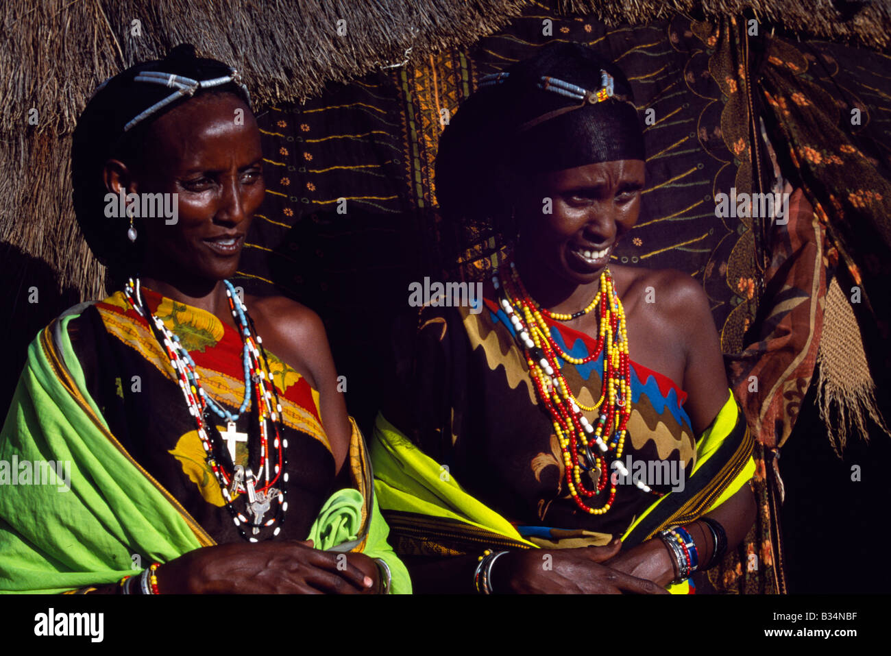 Kenya, Chalbi Desert, Kalacha. Gabbra women wear brightly coloured ...