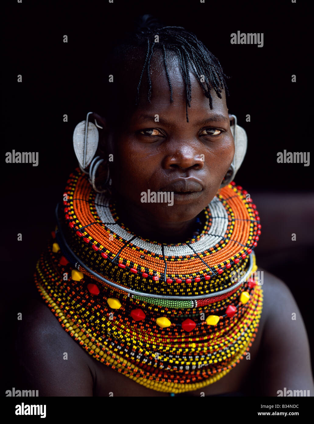 Northern Frontier Kenya, Northern Frontier District, Loyangalani. A Turkana woman sitting ...