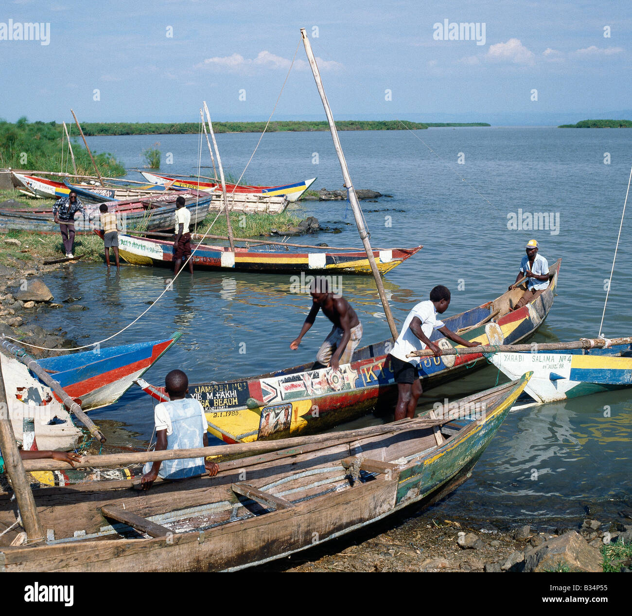Kenya, Kisumu, Dunga Beach. Brightly painted fishing boats of the Luo