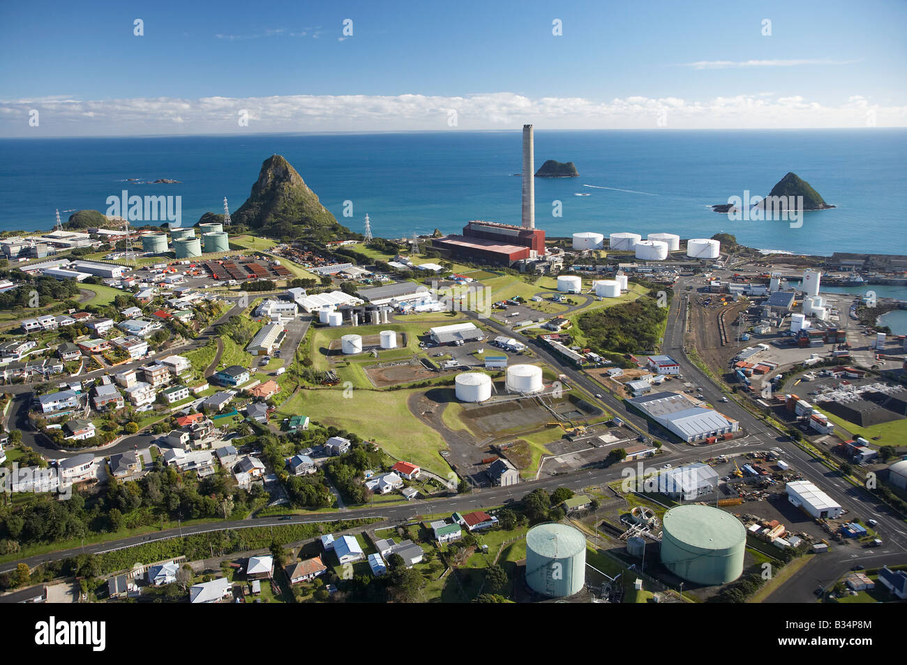 Bulk Fuel Tanks Residential Houses New Plymouth Power Station Paritutu and Sugar Loaf Islands New Plymouth Taranaki New Zealand Stock Photo