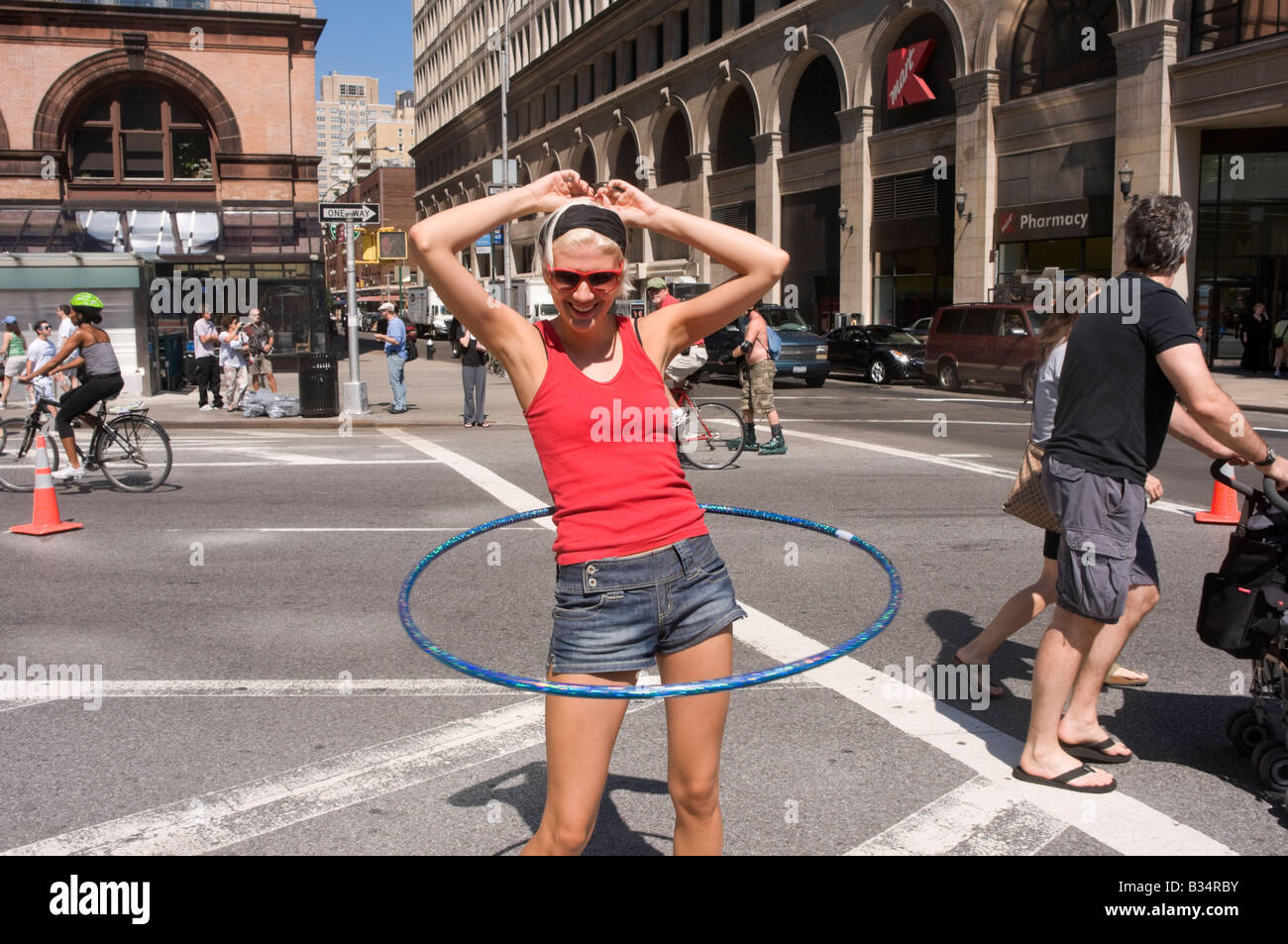 A woman hula hoops in the East Village, near K-Mart, during Summer Streets.Hula Hoops, Stock Photo