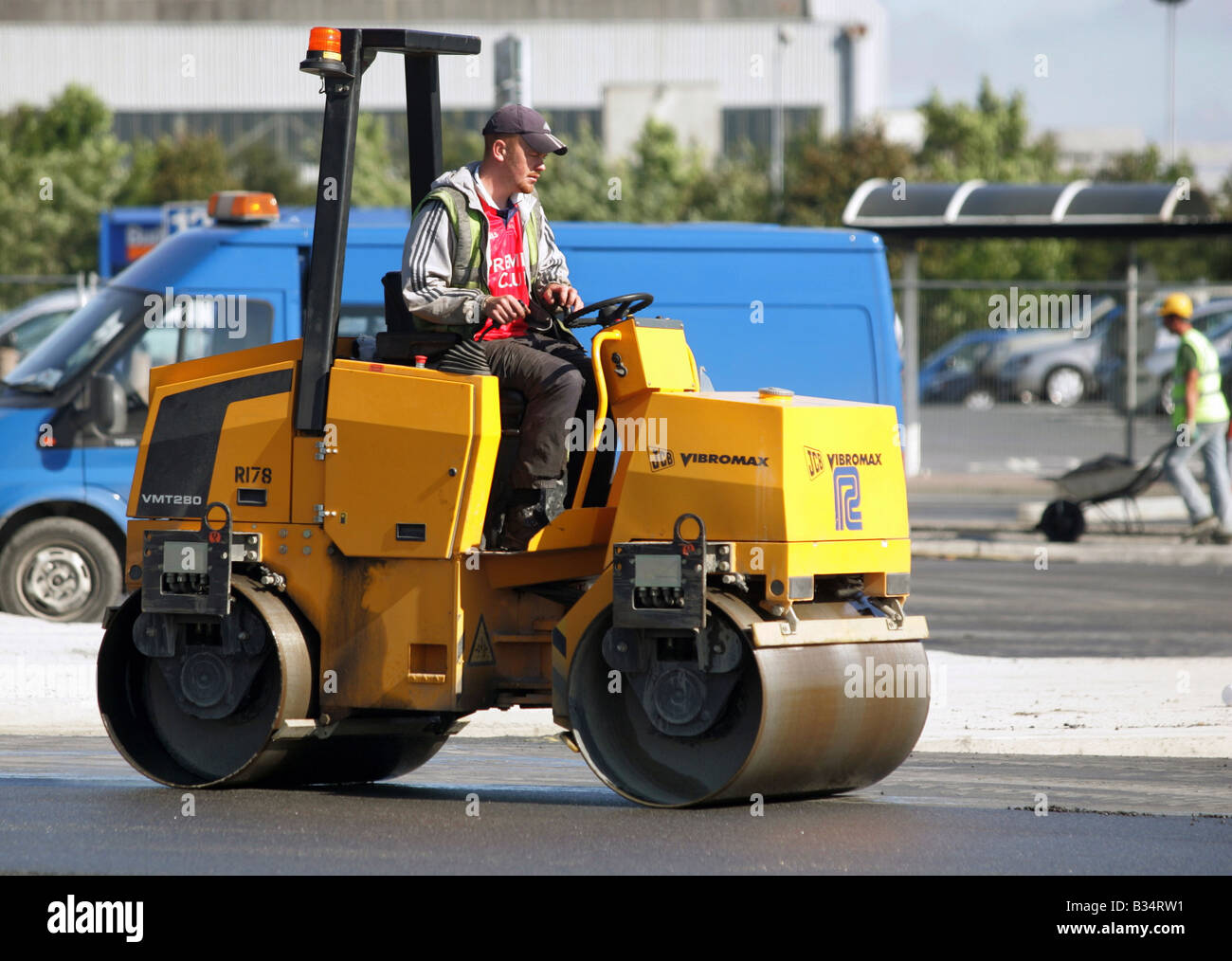 A construction worker in a road roller, Dublin, Ireland Stock Photo