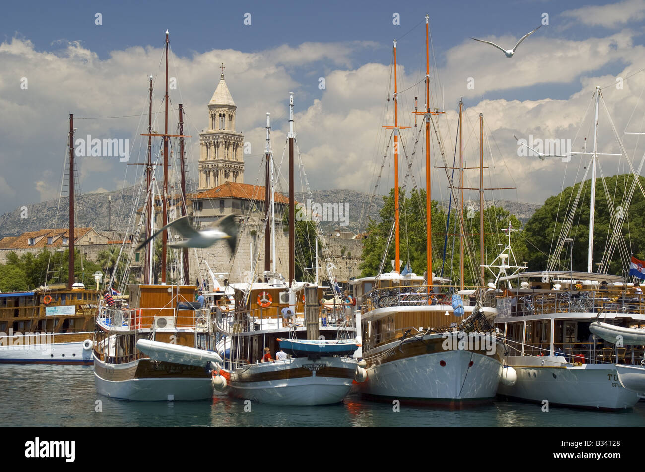 Split waterfront with masts of sailing yachts and tower of Diocletian's Palace Stock Photo