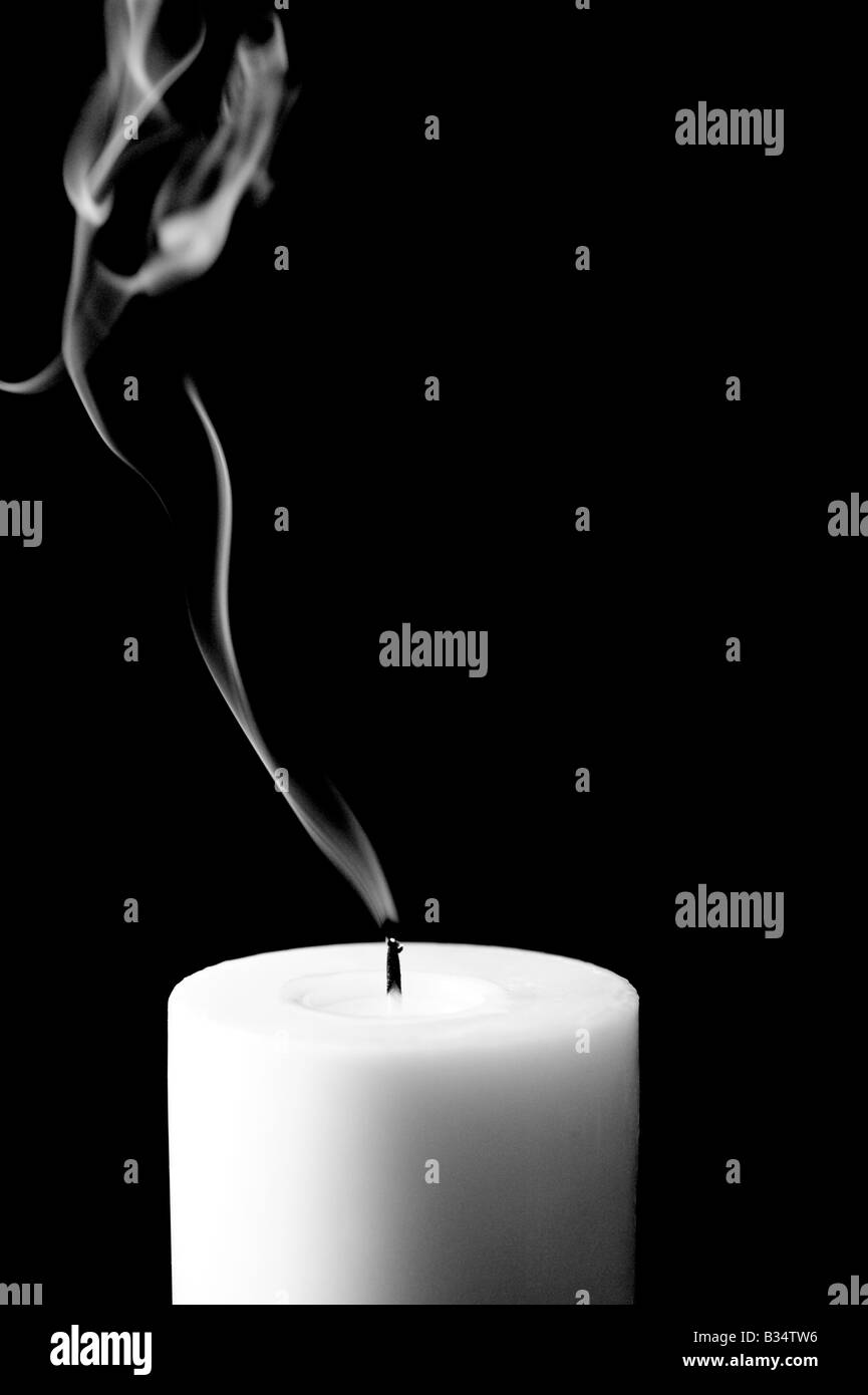 Candle just blown out showing smoke trail Stock Photo Alamy