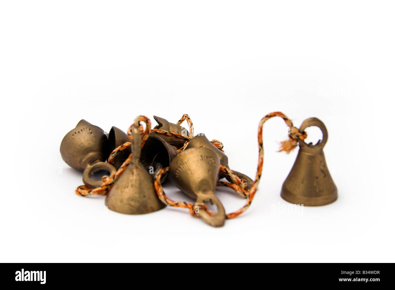 Bells made of brass, white background Stock Photo Alamy