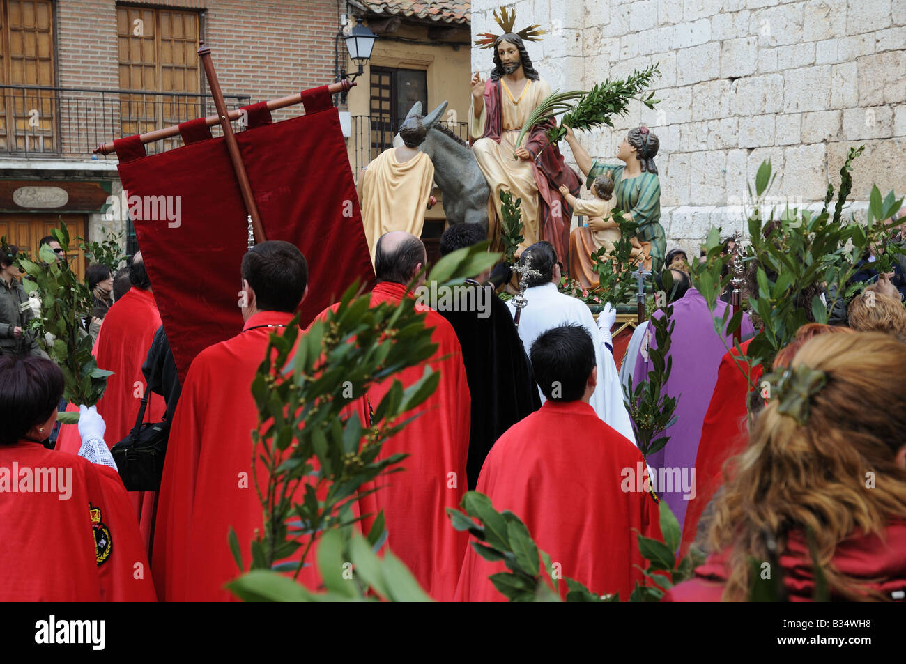 Priests and people gather outside the Church near a Float for Palm Sunday procession in Tordesillas Castile Leon Spain Stock Photo