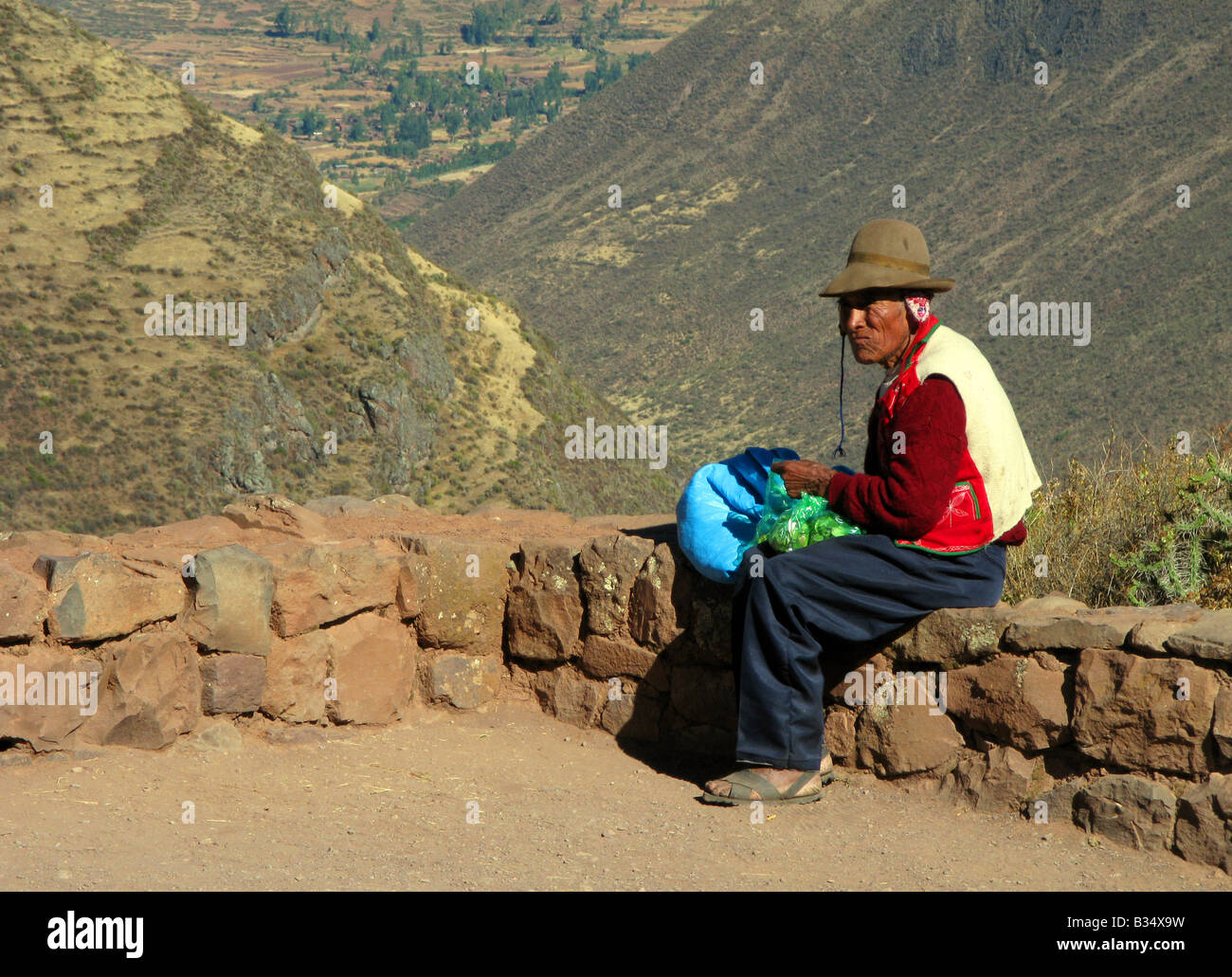 A man selling coca leaves Inca terraces at Pisac in the Sacred Valley