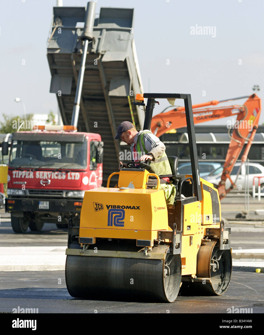 A construction worker in a road roller, Dublin, Ireland Stock Photo