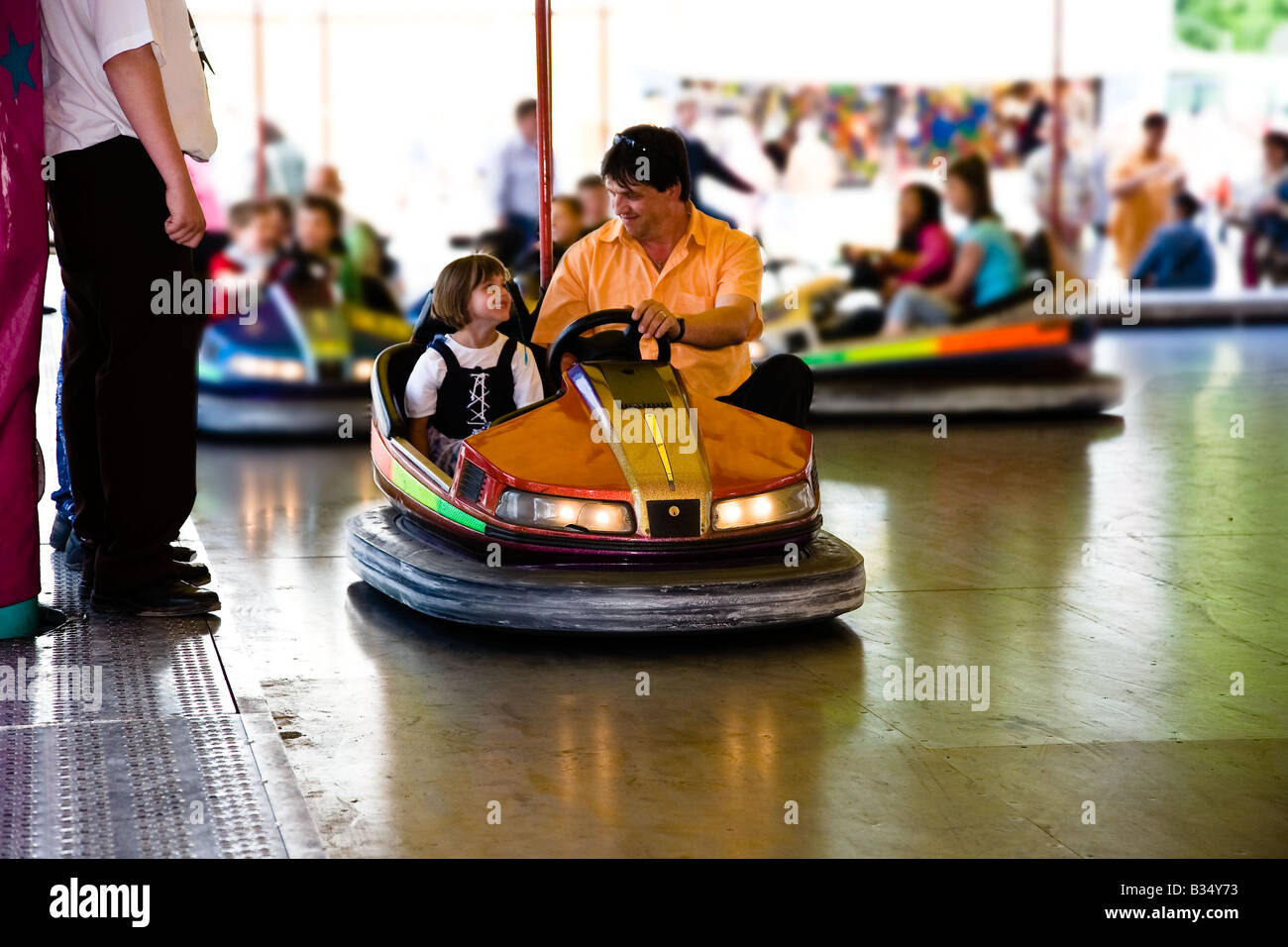 Bumper car with father and daughter on kermis Stock Photo