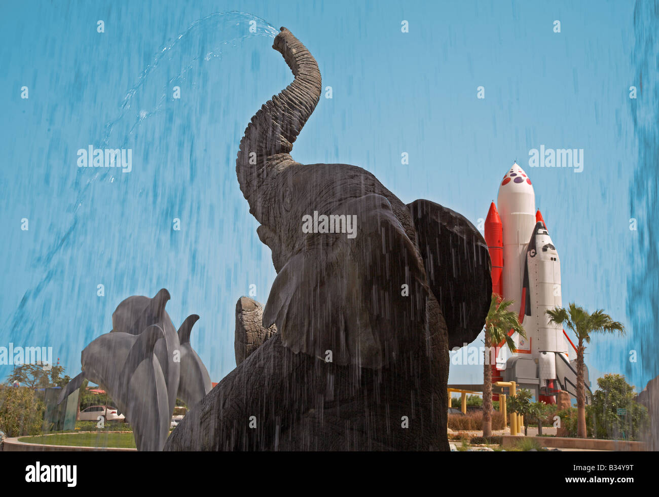 water spouting elephant and dolphins delphinus in Dubailand Stock Photo