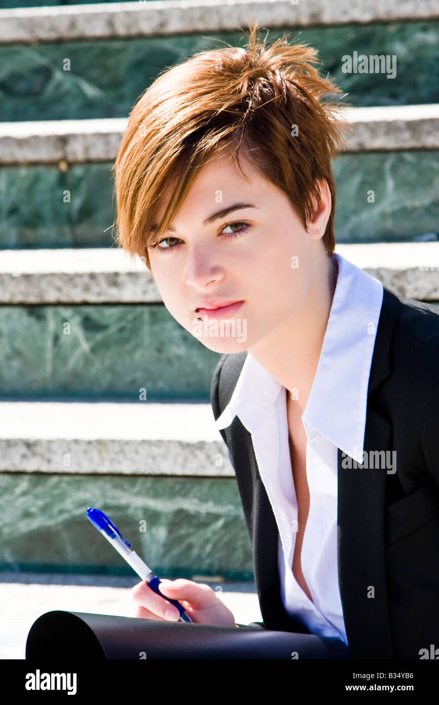Short haired businesswoman staring at camera Stock Photo