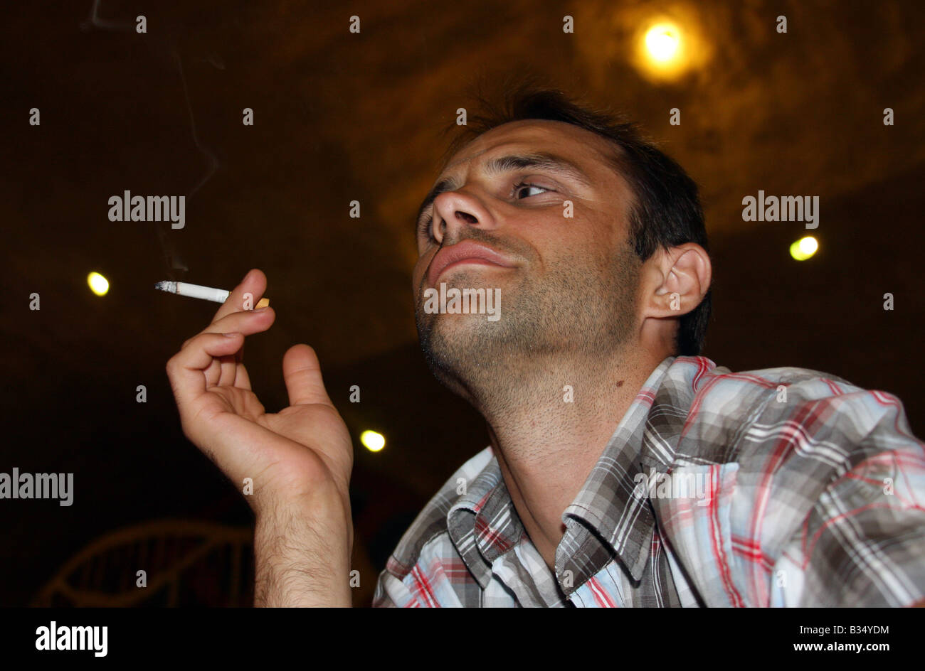 Man enjoying smoking the cigarette. Stock Photo