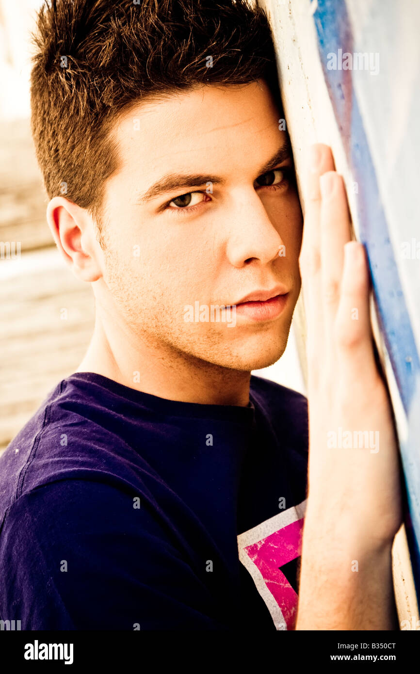 Young man portrait over grafted wall Stock Photo Alamy