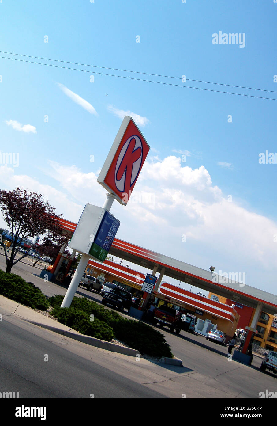 A roadside American gas/petrol station, on a Summer's day in