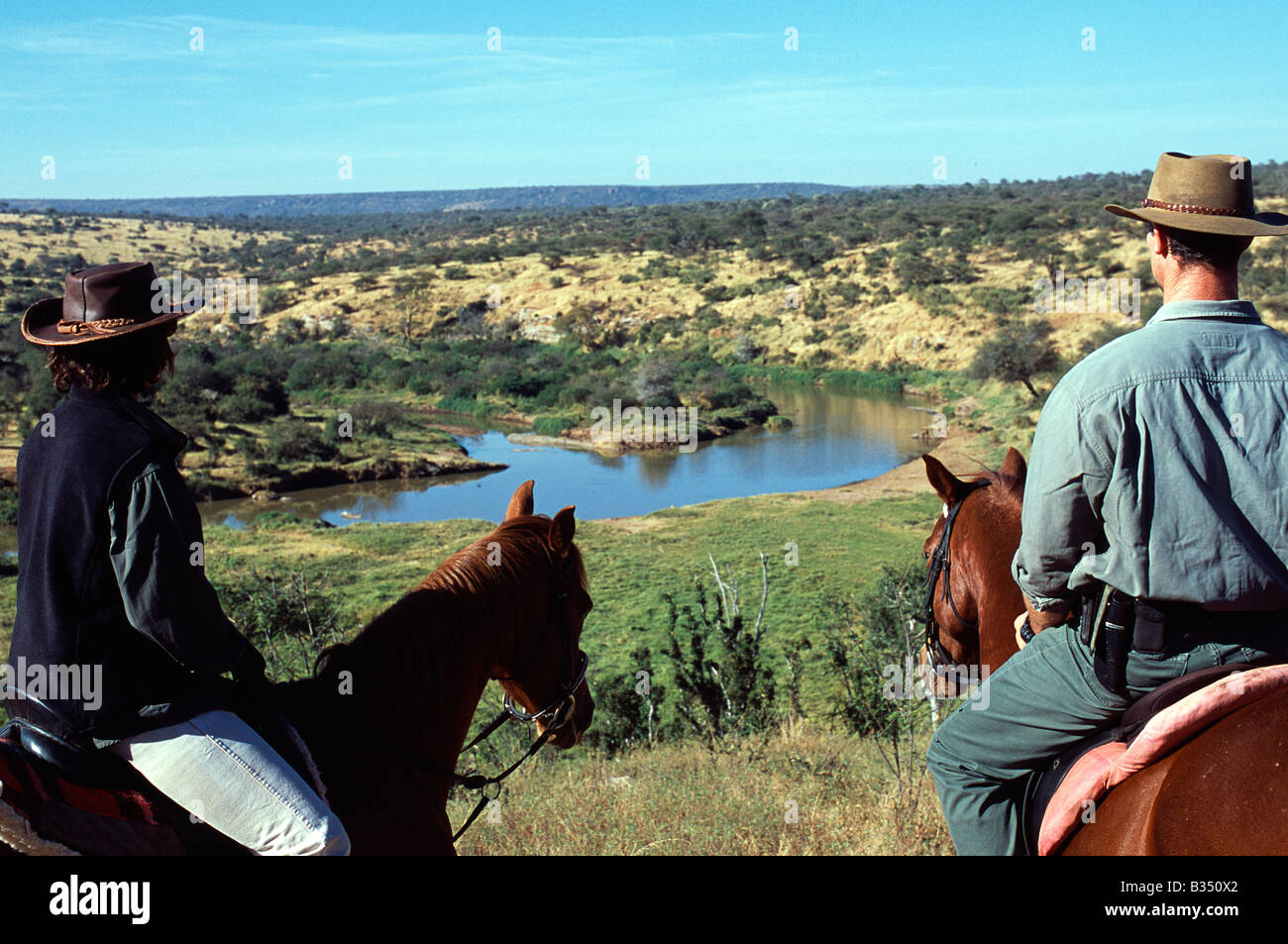 Kenya, Laikipia. Looking down over the Ewaso Nyiro River whilst horse riding at Sabuk. Stock Photo