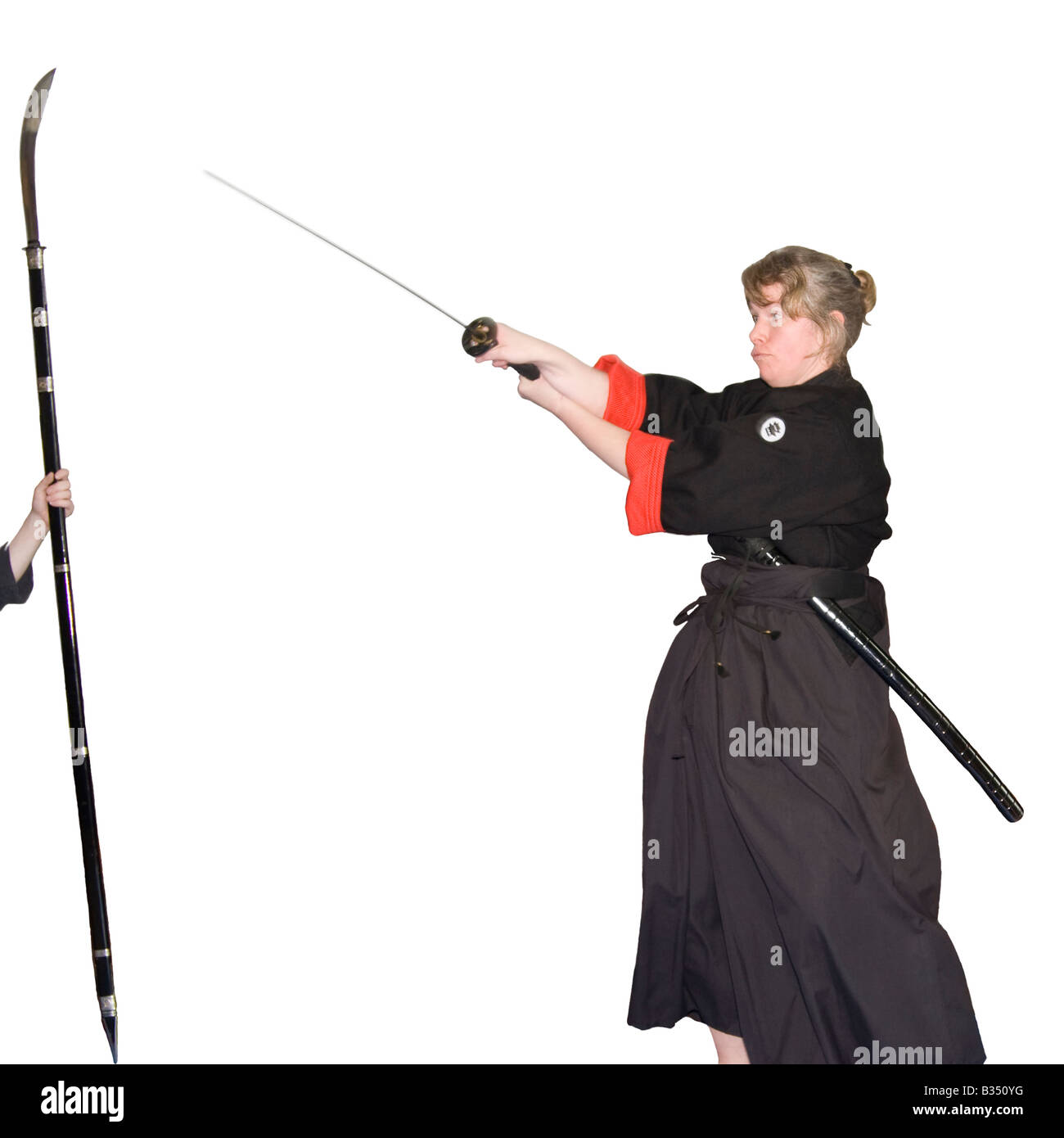 Female martial art fighter performance in a traditional outfit Stock