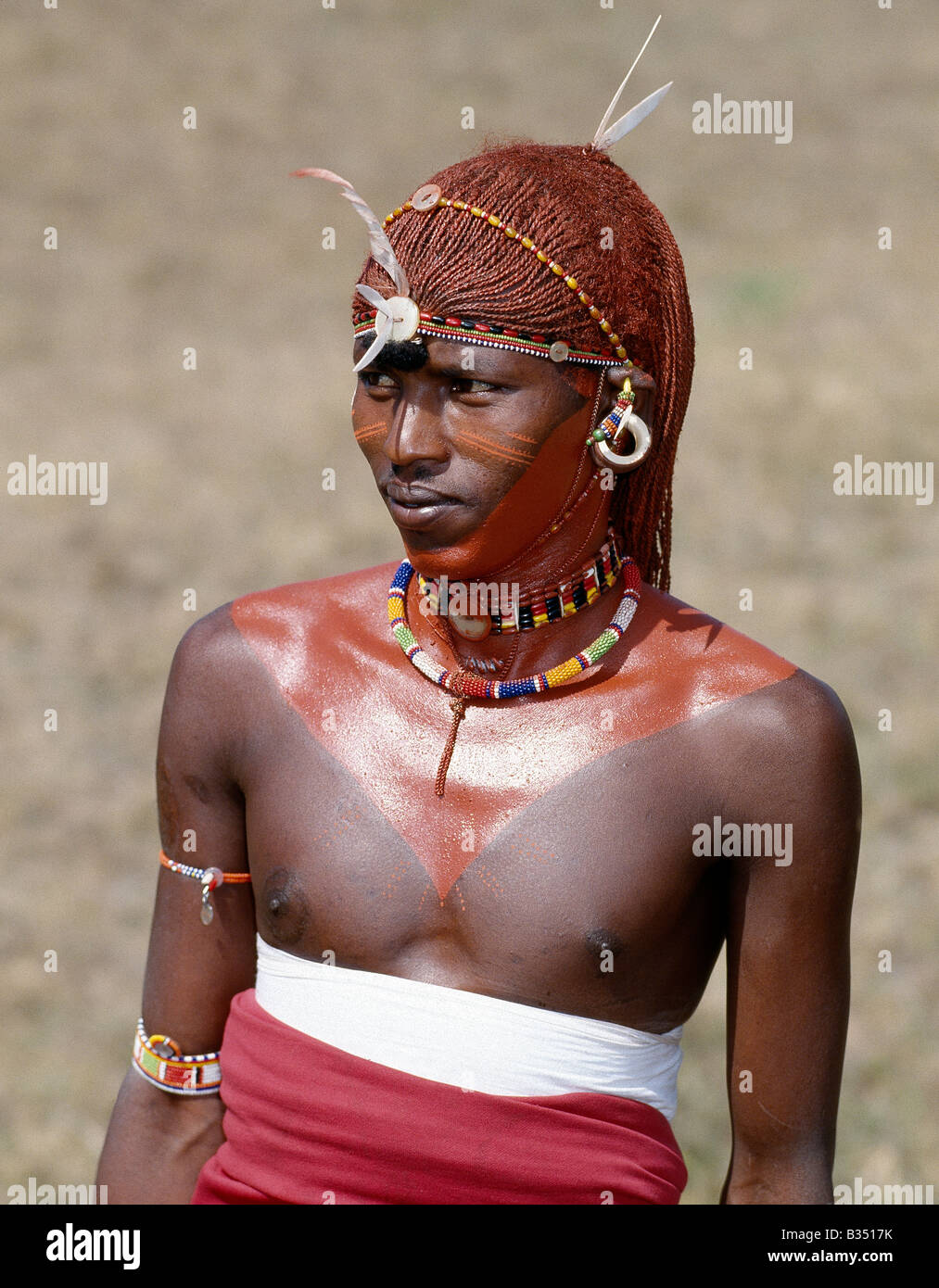 Kenya, Maralal, Maralal. A Samburu warrior resplendent with his long braids of Ochred hair. Stock Photo