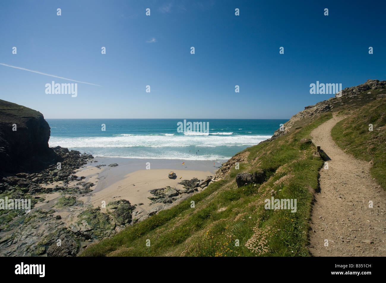 Chapel Porth beach cove in summer sunshine with Atlantic surf North Cornwall West Country England UK United Kingdom GB Stock Photo