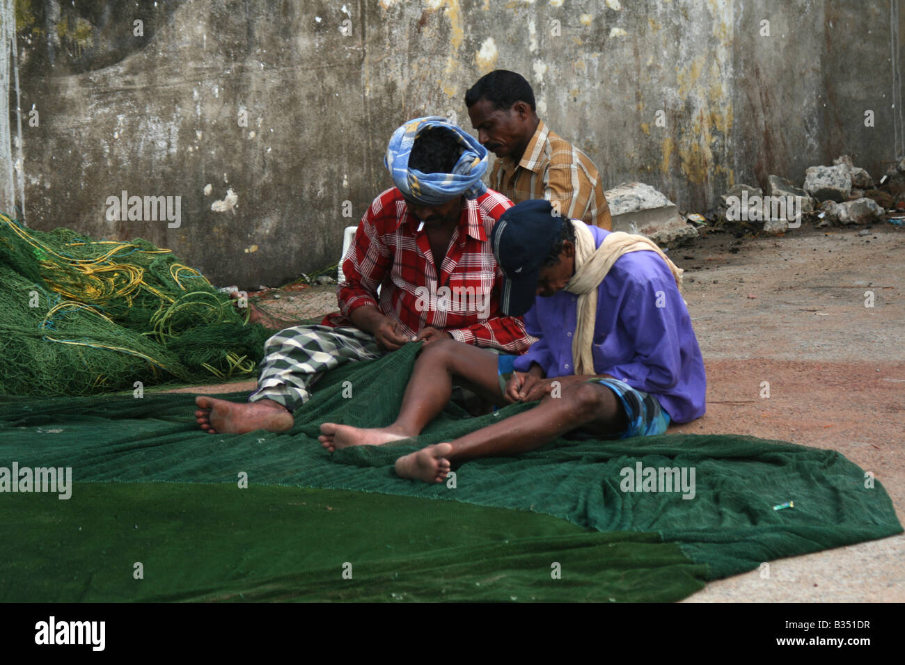 Colour image of Fishermen weaving Stock Photo Alamy