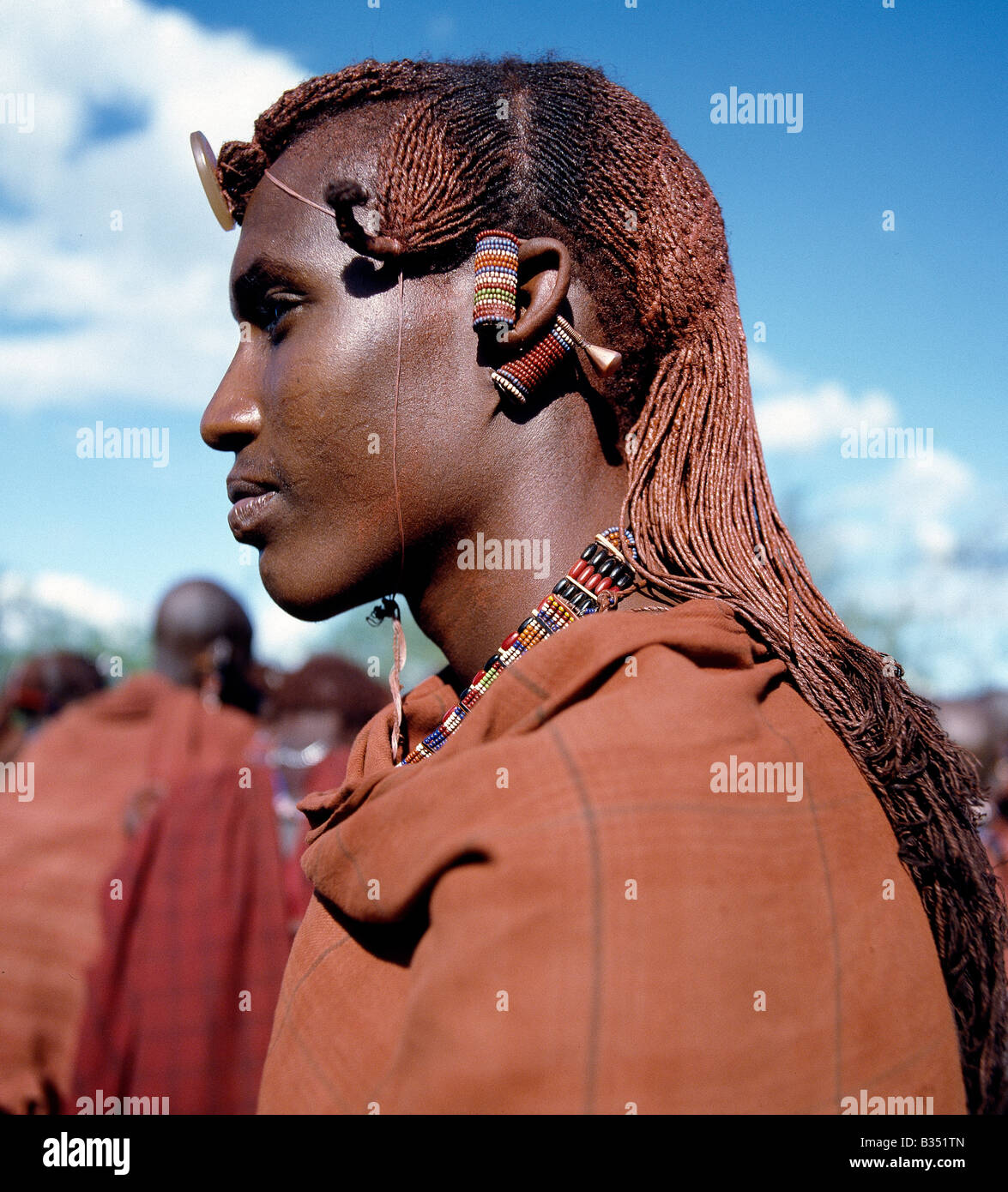 Kenya, Kajiado, Maparasha. A Maasai warrior resplendent with long, ochred braids. This singular form of hairstyle distinguishes Stock Photo