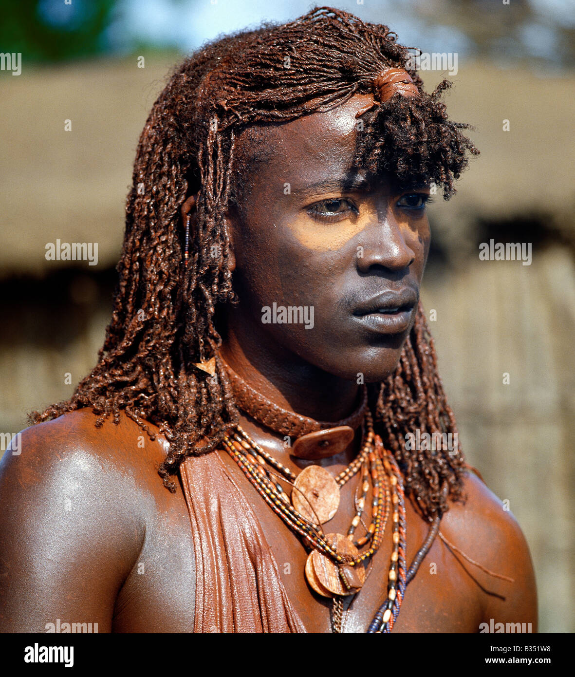 Kenya, Trans,Mara, Lolgorien. A Maasai warrior with his long