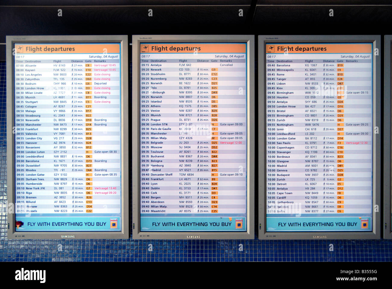 Travel destination flight departure boards with destinations and flight  times displayed at Amsterdam Schiphol airport in Holland Stock Photo - Alamy