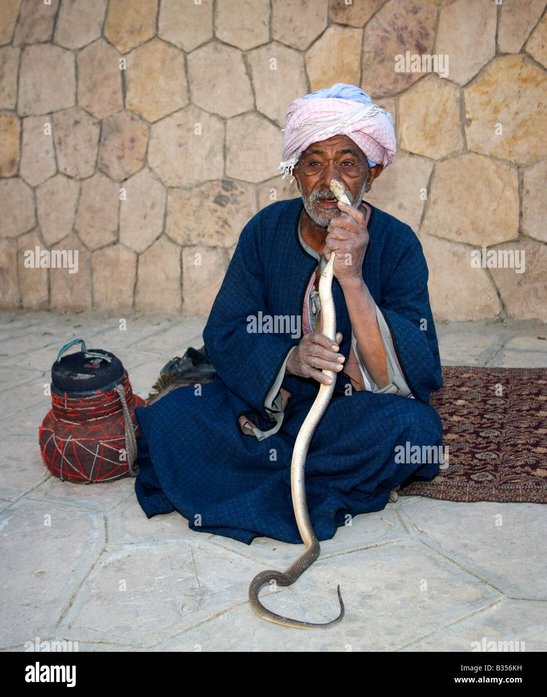 Old egyptian man snake charmer with cobra Egypt North Africa Stock Photo
