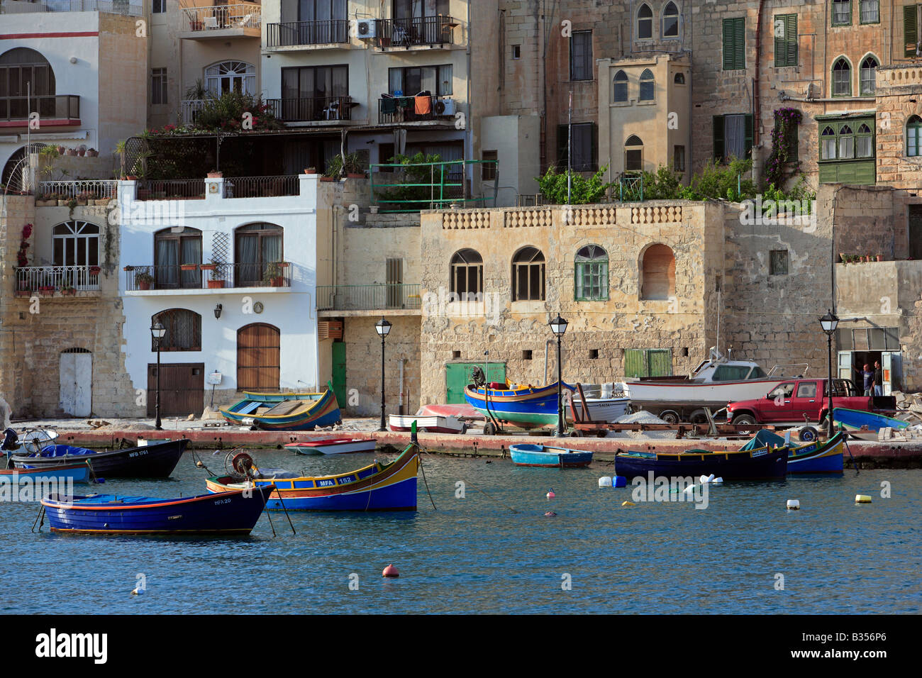 Traditional Malta fishing boats (luzzu), St Julian's Bay, Malta Stock Photo