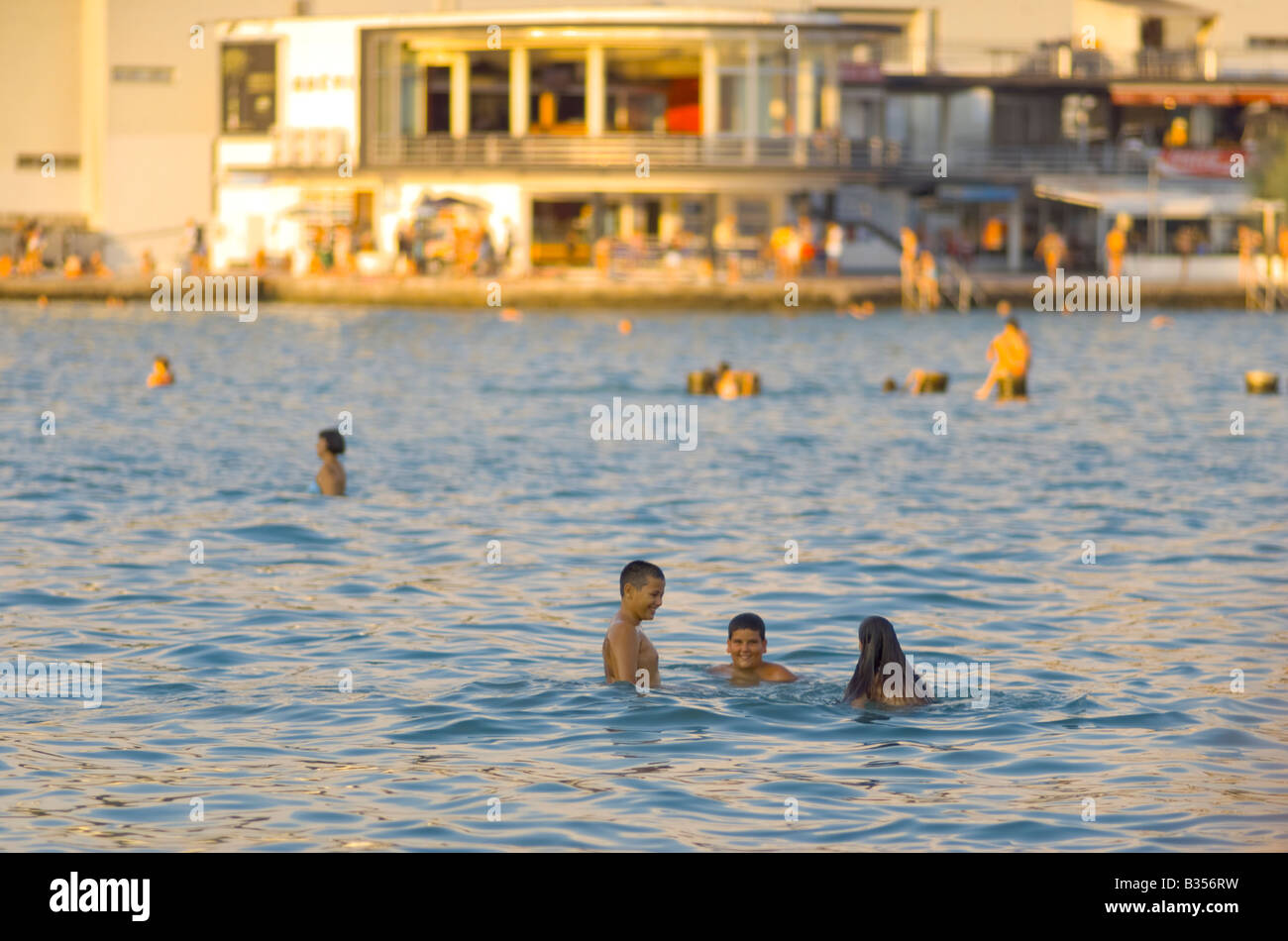 Swimmers at Split city beach Croatia Stock Photo