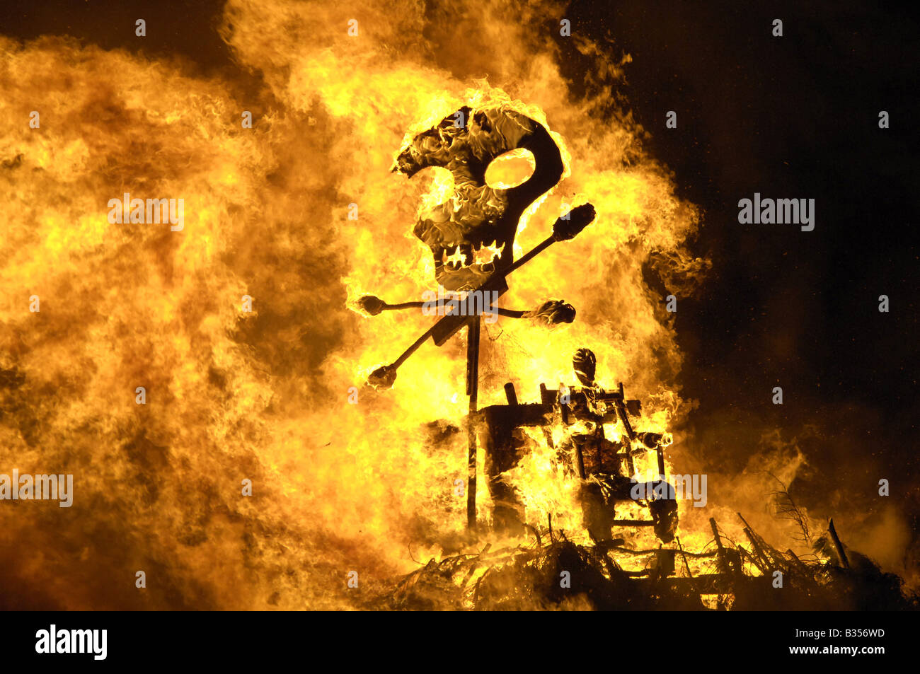 Burning Guy and skull and crossbones on top of Cliffe Bonfire Societys bonfire, Lewes, East Sussex Stock Photo