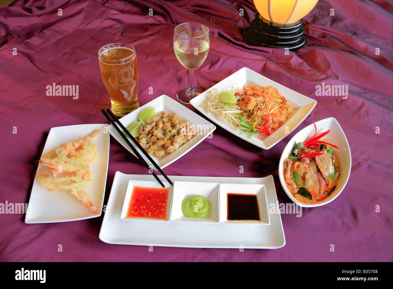 Thai Food Deep Fried Squid Szechuan Duck Dip Sauces Stir Fried fresh vegetables dish in a restaurant setting Stock Photo
